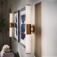 Quintiesse LED bathroom wall lamp Facet Dual, brass, 2-bulb, width 66 cm